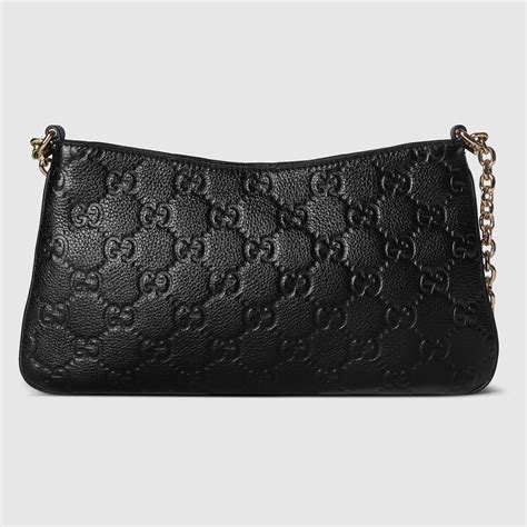 gucci bag light blue - Gucci GG Emblem small shoulder bag.